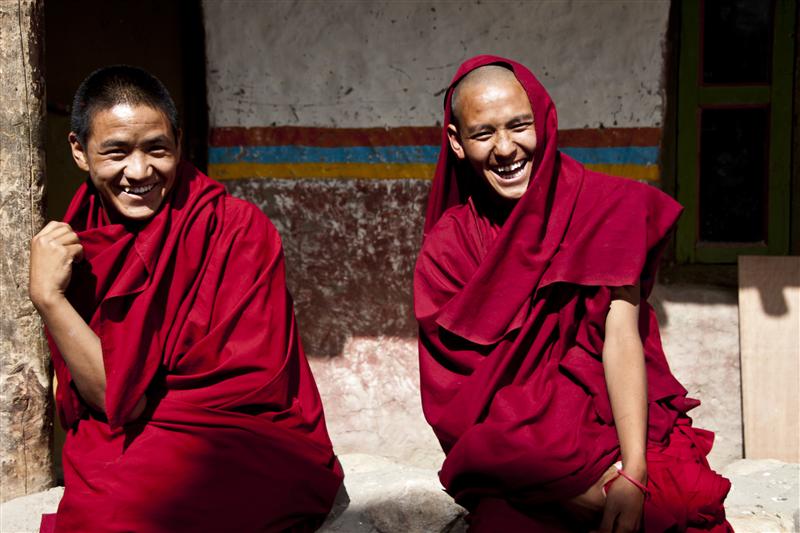 Young monks laugh over a joke made by one of the other monks in the moastic school in Tsarang