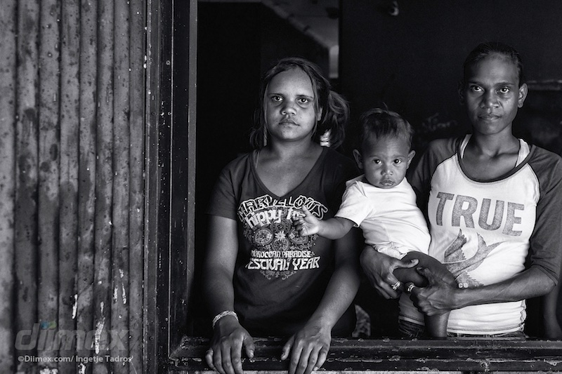 Royanne (Maagka), and Sardie and Chrissy, posing in an abandoned and condemned house in Kennedy Hill.