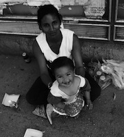 Roma mother begging with child