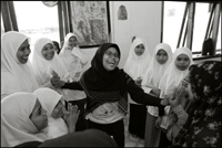A student of the Fajar Hidayah organization plays a game with the girls at an orphanage in Banda Aceh Indonesia